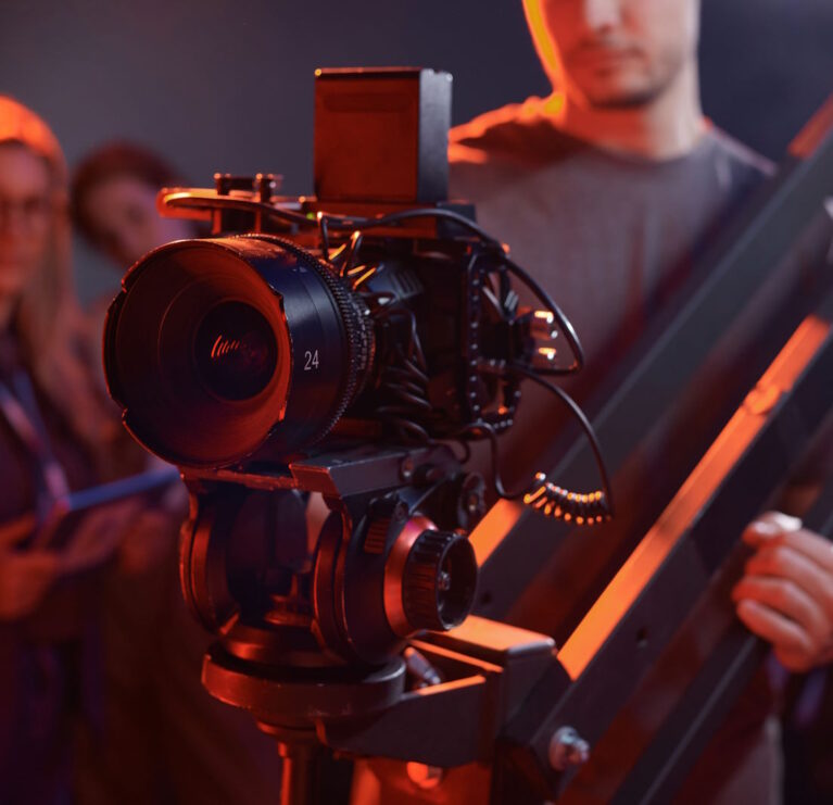 Closeup of cameraman operating video camera on rig in studio with red neon lights copy space SSUCv3H4sIAAAAAAAACpxTy47bMAy8F+g/BD5XgGQ9LO+vFD3QErUR1rEDW95isci/l5btRNmil97EITkaUcPP799Op6qDObrq5fS5RhTHvl/mNEGK40Aw/7HjEw4epxJ5n6ThJQCxjNDHNE4R+hLsILnzABckcFj6foVvOVnNCdIy41xomc9LSjjNaXRvBIuDRdRyCiUQJsRrzDUFo4OEryThifN4788tPh2JnKQOSlXVzruJWLqMHdBG/l+d2+HXfV6vOLiPh7a/X3wXefpCLcSd9aBbCXu4fHxpMyZY2fKWeRMCUyAMA+ORmaZF4etaKsGfqGXonOoCZ7JrampoArOtMwxlLXzXYIOBPy7fDrdi6hP2CNs/7joq6bzmqgNiU5wppZGBlZZpbEC40Hklw6GhakOtkVvBWgOCKVc7Br6hk/UotQX05LqjuDZUKQUwzwWJlSiZ1STbaI0gwNfe6Cx2m1L19pume8l+2OXC4uNY+ON9dNCvBbJ4E8QrTPDUd52ii8NrgYzpnBfkYHLjMqRp/Y/731X9OF6h61f7B7oGD/wM80zl/sBLF9M6jpfinmFMebo7a+XJ5msoJI3HWGVqIa2VUtm9YNuscySeLOcQuFz7ETyul/7TgaIRquZNy5uHze7rl3OtEfaRKzZxzQpu67ySzx7J7NGX84yrjMpAF4QiyxkhNVOdIhuAbBgZzzlltdQN0n/e/gAAAP//AwD0tMuqvAQAAA==
